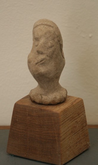 (bust of woman with distorted head and pearls)