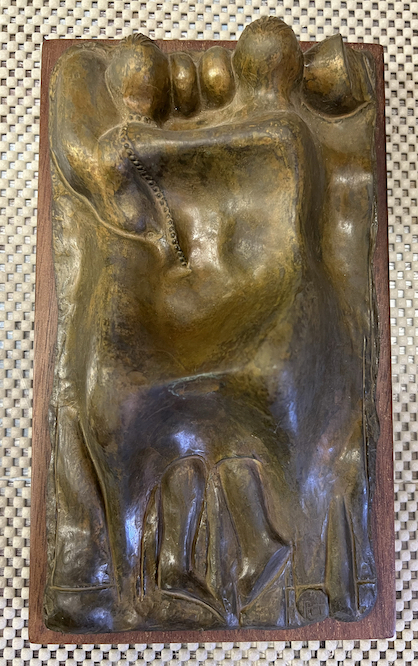 Two
figures laying in a bed