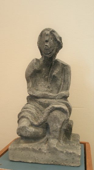 (seated figure)